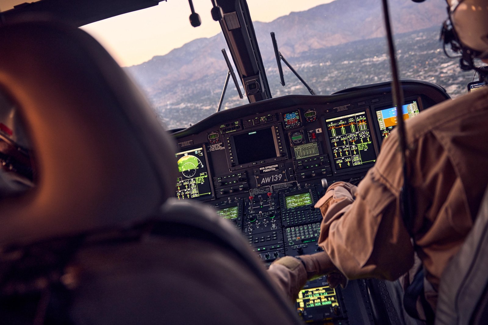 LAPD SWAT helicopter cockpit overlooking mountains at golden hour